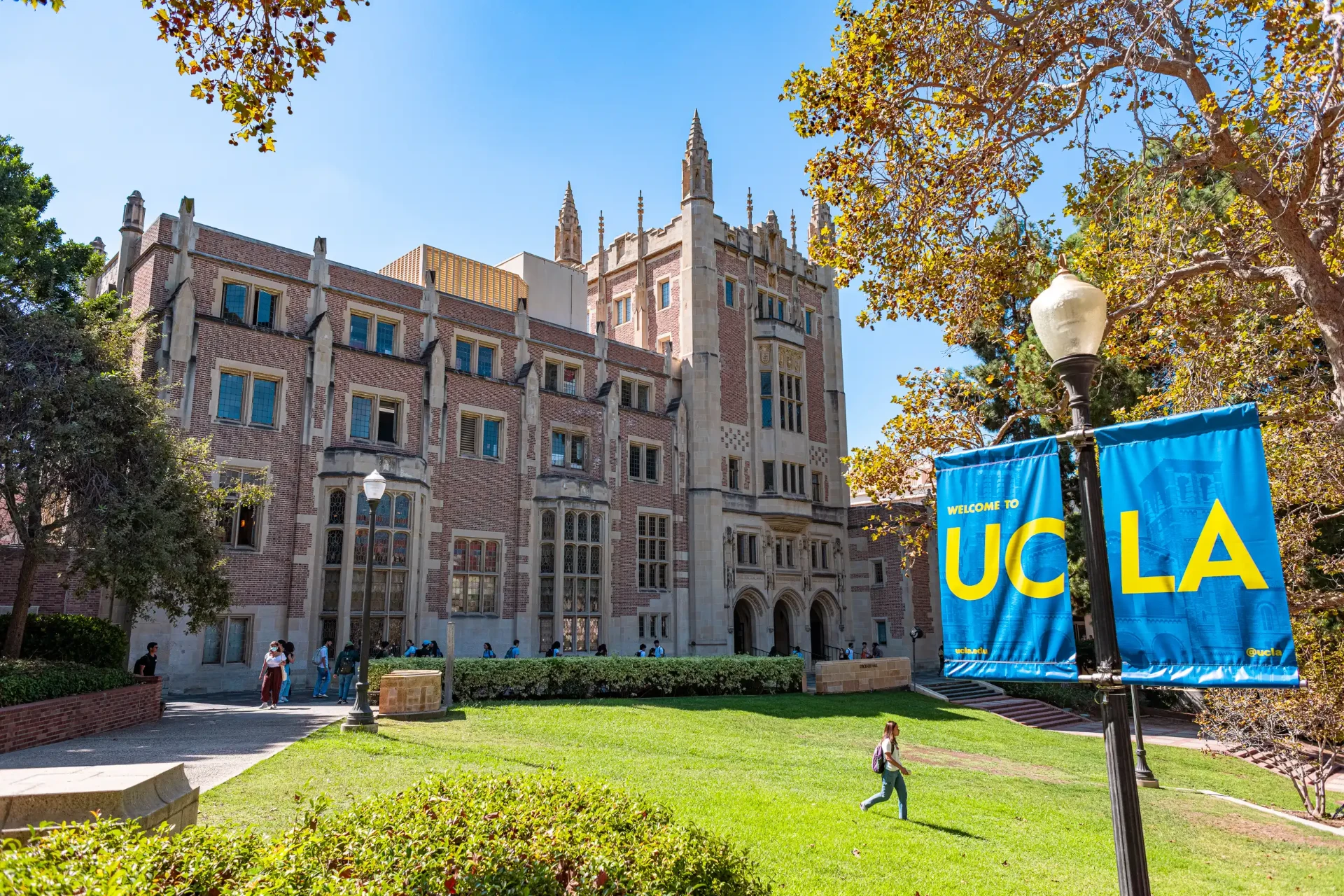 UCLA campus with historic brick buildings and the iconic Welcome to UCLA banner
